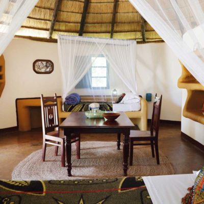 6Planet Baobab - Bakalanga Hut beds and dining table detail
